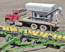 ) equal split hopper is standard Conveyor transports to front and swings 152º to fi ll most planters with only