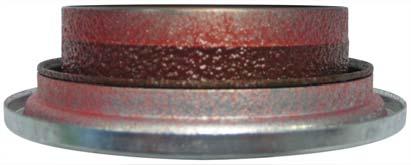 The presence of the red pre-grease between the primary and secondary seal lips indicates that the leak is not coming from the seal lip-to-yoke sleeve