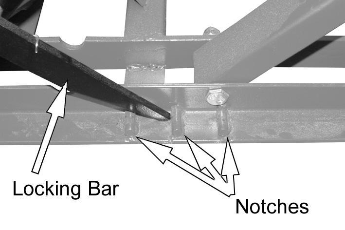 Once you have reached the desired height, ensure the locking bar is engaged with the notches on the base, 7.