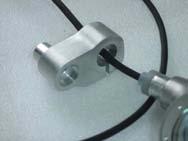 Make sure that the white silicon plug extends through the back of the mounting block hole, around the light wire.