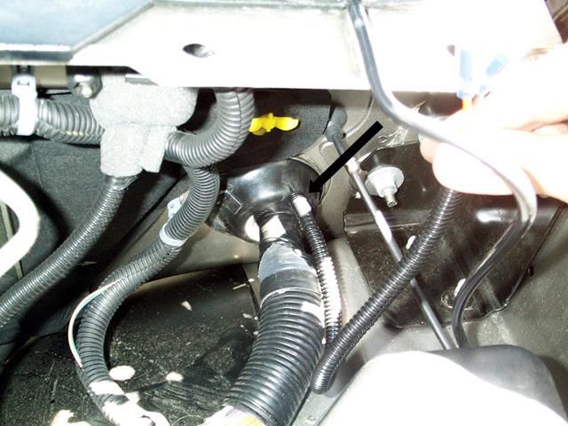 Push the black wire with the male bullet connector through the firewall grommet and connect it to the female bullet connector on the black wire coming from the brake controller module.