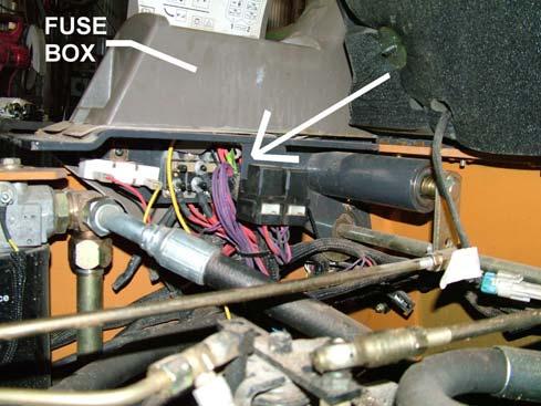 Remove the foot rest floor and route the wire harness under the seat as shown.