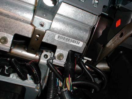 Replace the 3 screws and the lower finish No. 2 panel (Refer to Figure 28 on Page 13). Be sure to plug the glove compartment light back in. 38.