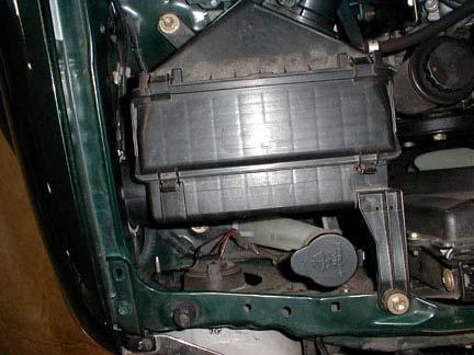 The bolts and air cleaner assembly will be reused. Figure 1 Figure 2 4.