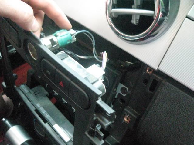 STEP 7: Remove the (6) screws that retain the radio trim plate, using a ¼ nut driver.