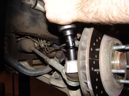 Start by removing the factory tie rod end links from the steering knuckle, or upright.
