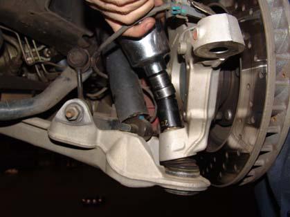 You will see two flat spots on the upright, tap these with a hammer to loosen the taper at the pin and you should see the lower control arm separate from the