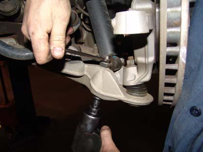 Figures 4a and 4b Removal of lower front shock mount