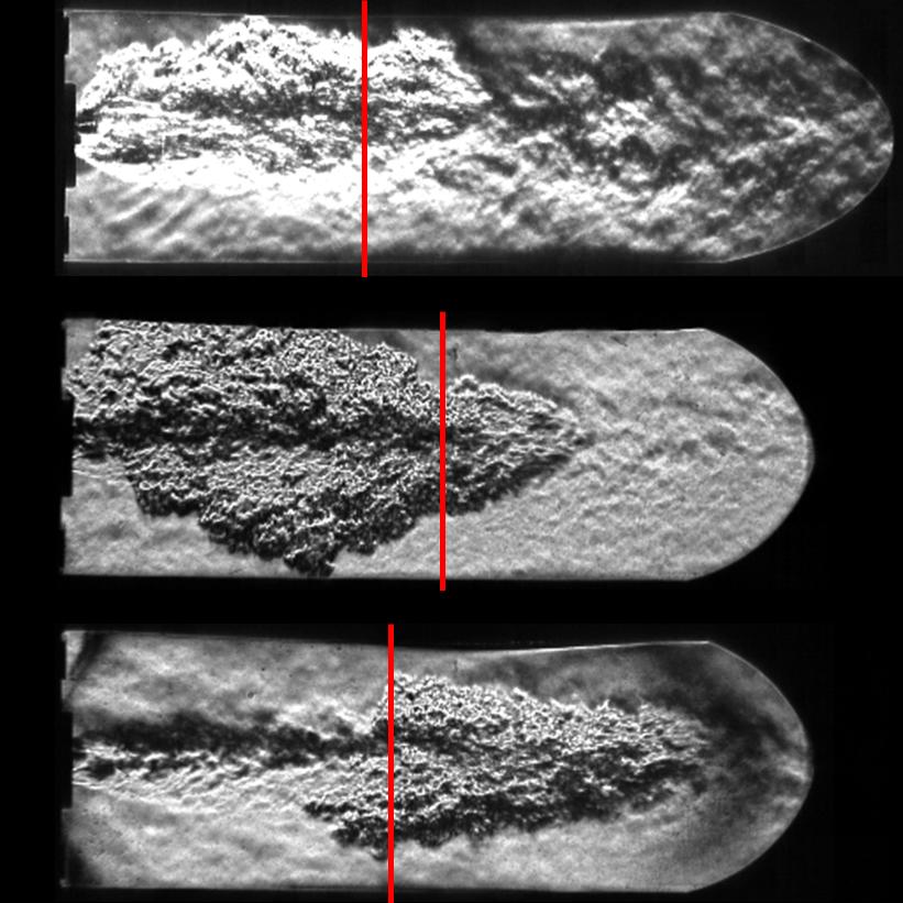 progression of the downstream flame front in the Schlieren images.