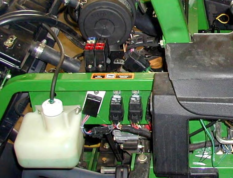 ELECTRICAL MOUNTING 3.1) Disconnect battery. 3.2) The cab is supplied from the factory, pre-wired. Locate the 12 Gauge red wire that runs down the right rear cab frame tube. 3.3) With the engine hood opened, route the wire to the right inside area of the engine compartment.