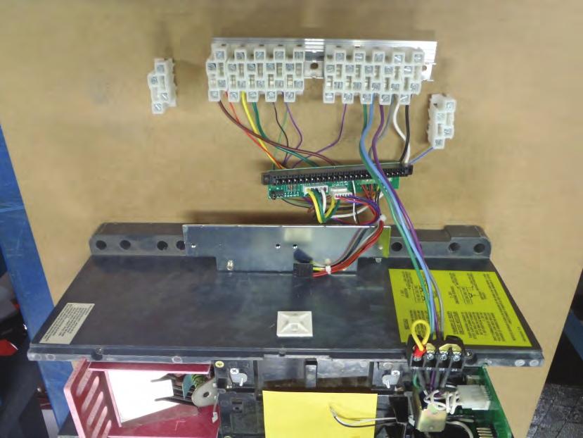 Location of the Rail Mounting Screws. Figure 10 shows an R-Frame G Series (RG) Retrofit Kit supplied prewired edge connector board and C/D terminal block assembly.