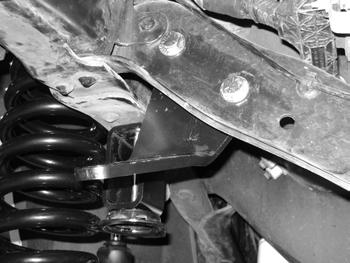 Step 11 Note Hardware for the steering stabilizer braket is located in bolt pack 657. 11. Install the new stabilizer frame bracket to the back side of the frame crossmember using the 2 front holes towards the passenger side.