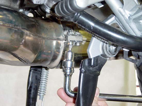Loosen the metal clamp at the header tubes