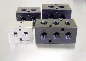Multiple Connection Manifolds PNEUMADYNE, INC. Catalog 400 Phone 763-559-077 Fax 763-559-0547 l Output port spacing is.