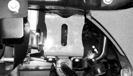 FIGURE 11 36. Install the sway bar link ends in the original axle mounts and secure with the OE hardware. 05-06 MODELS ONLY 37. Remove the metal ABS retaining tab from the radius arm.