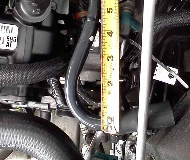 INSTALL Figure I Refer to Figure I for Step 25 Step 25: Measure approximately 4" from the end of the OE vent tube and cut to accept the new 5/8" rubber vent hose.