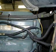 Locate the engines injector harness connectors at the left rear lower corner of the engine. (see figure 4 below) There are two major harness connections in that area.