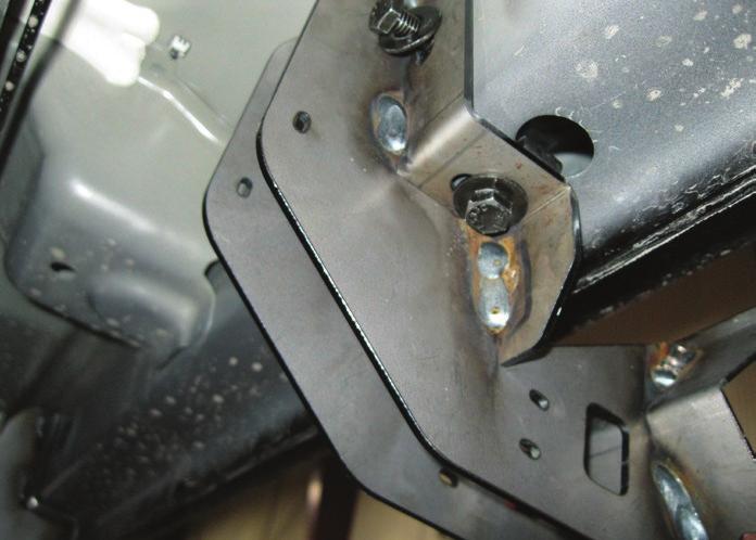 Place the driver-side front mounting bracket onto the vehicle and secure with two M8 hex