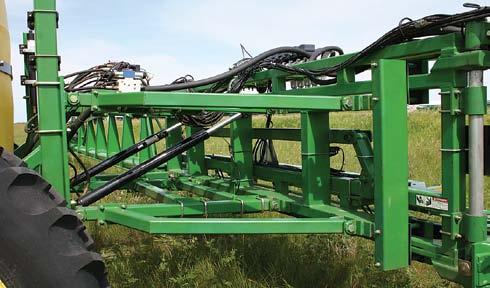 without leaving the tractor cab. Adjust boom height on the go, OR; raise either boom tip to clear obstacles.