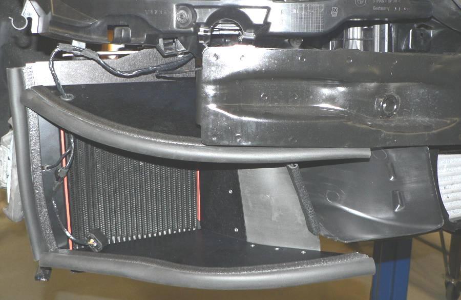 You can now remove the aluminum Oil Cooler Retaining Strap on the Cooler Assy. Fig: 38 Fig: 39 46.