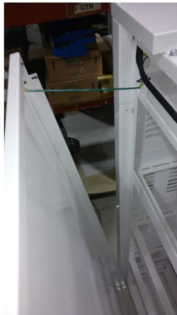 Remove the front part of the top cover; be careful the rear part is fixed to the cabinet frame. Remove the side panels to have a full access to the battery area.