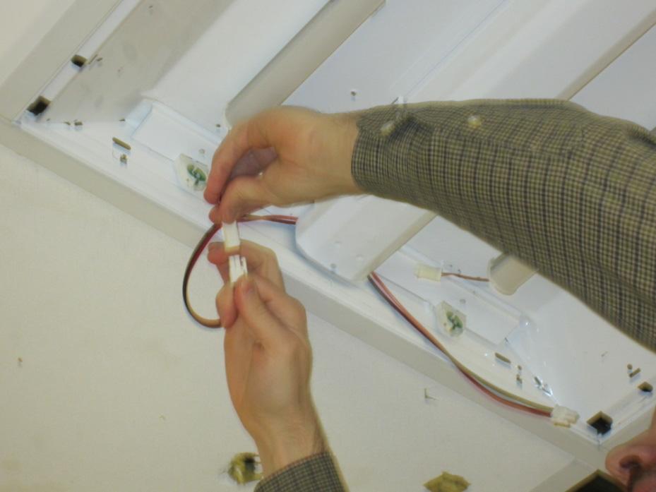 Reattach wire compartment by snapping into place over driver insuring no wires are pinched. See Figure 12 Figure 12.