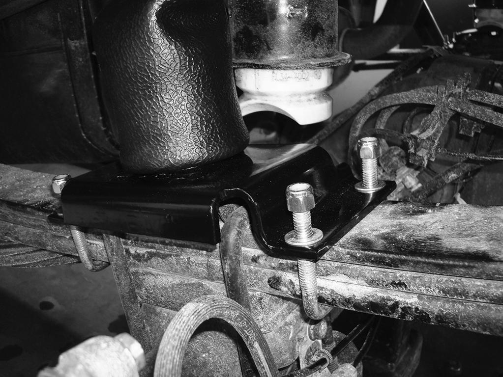 RideControl 4. Set the lower bracket U-bolts (E) under the leaf springs and through the holes in the lower bracket (fig. 15) and cap with four 3/8 flat washers (J) and 3/8 nylon lock nuts (I).