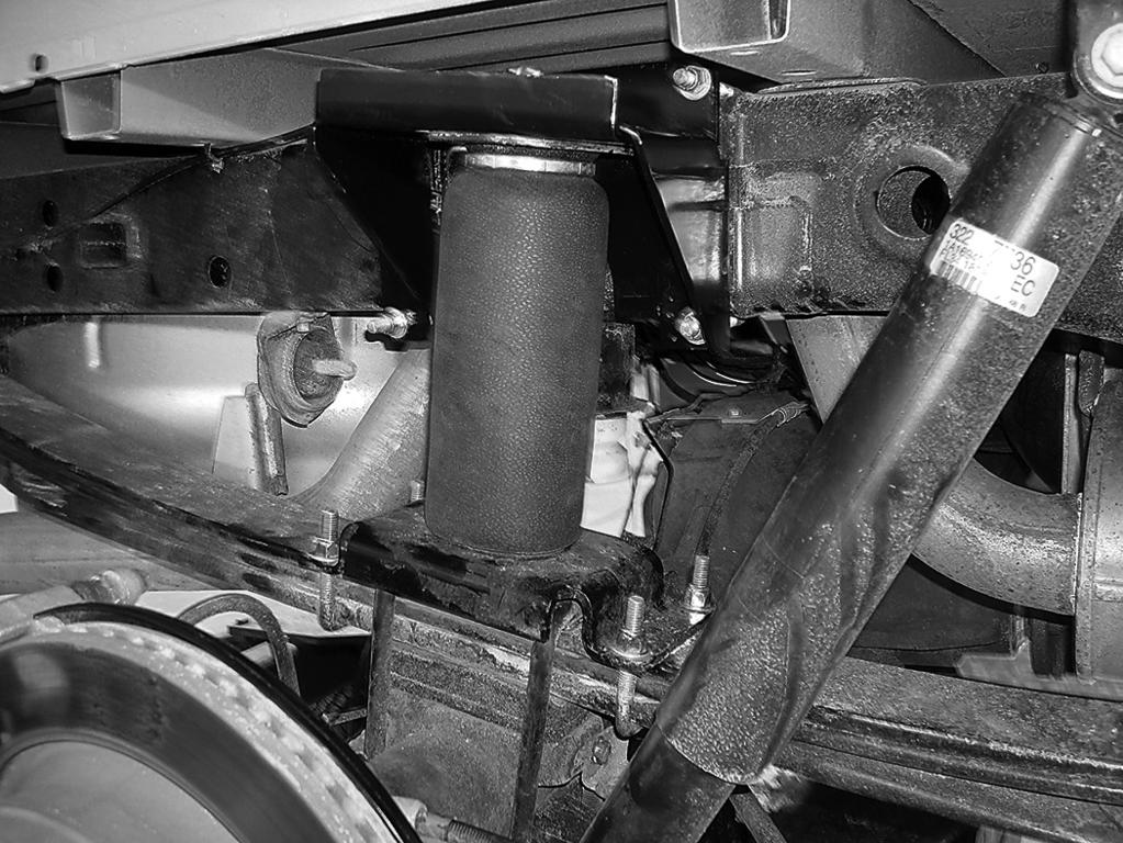 Figures 24 and 25 show the left- and right-hand assemblies installed on the vehicle. Back, side view of left side (driver-side) installation shown. fig.