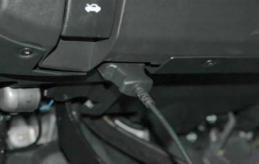 5. Locate the OBD II plug connection along the bottom edge of the dash to the right of the hood release lever. OBD II plug connection 6.