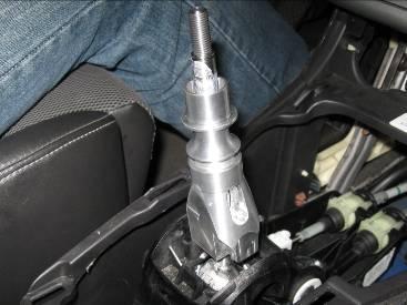 slot facing the passenger side and slide it down the shifter shaft.