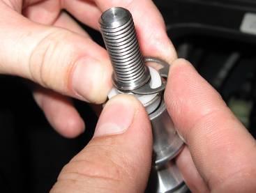 opening in the reverse lock. 33. Compress the spring and bushing past the groove in the shifter shaft.
