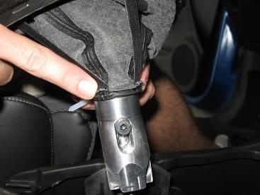 Remove the zip tie from the shift boot and slide it off the reverse lock for installation onto the TWM short