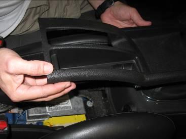 Page 2 2. Remove the cup holder located in front of the shifter by pulling up as pictured.