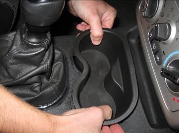 Unclip the shift boot from the console surrounding the shifter.
