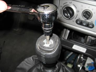 Remove the shift pattern piece and determine if your shift knob has a Torx screw holding the shift knob