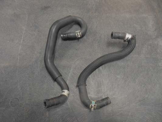 121. Note: This step applies only to 2009-13 Tundra. Ignore this step if you have a 2014-15. Here are the two OEM hoses and clamps removed from the throttle body.