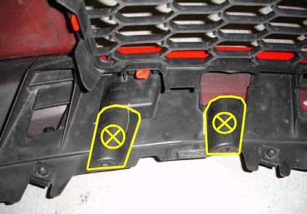 4. Before installing the front bumper you may have to trim the two plastic areas that used to retain the AATS wires with a razor blade or similar cutting device as shown.
