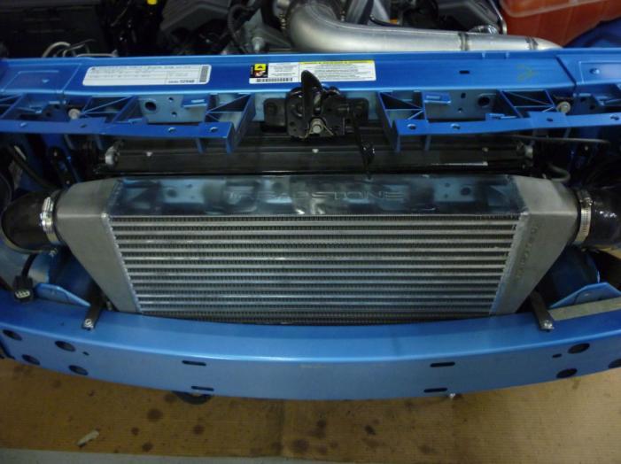 9) Locate intercooler and install from the top.
