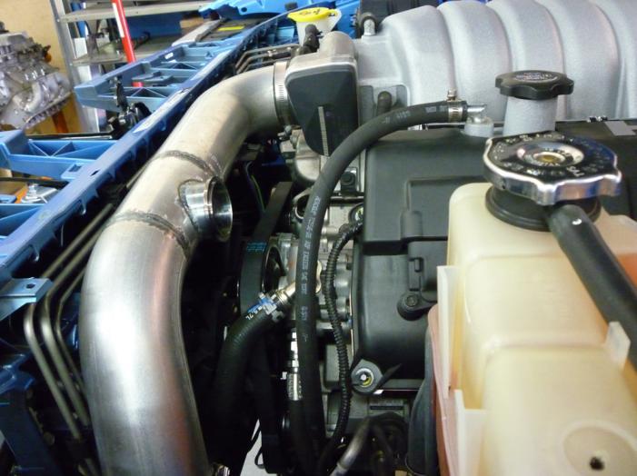 35) Locate left side forward air inlet pipe and K & N air filter along with 5/16 x ¾ bolt, nut,