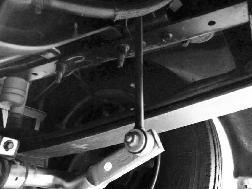 Lower the bar to the ground. Note: due to manufacturing variances, there may be only one bolt. Loosening the saddle bracket bolts will release the anti-sway bar.