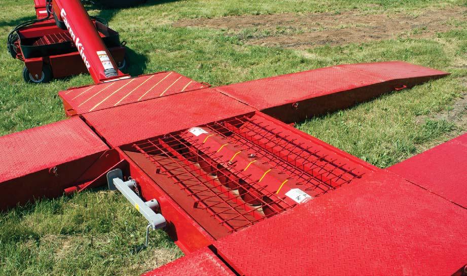 DRIVE-OVER HOPPER 19 [1] [1] 10" or 12" discharge tube feeds the auger [2] Side ramps fold up for transport with the ramp lift system.