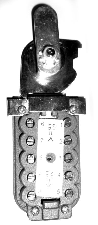 Small Triangle pointing up or down. Numbered Slotted Disk for Changing Key Pad Combination Figure 4 3. 4. When the plate is removed, there are ten slotted disks with triangles pointing upward.