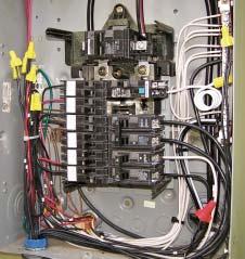 The load center is usually installed in the same enclosure as the transfer switch and connects to the switch, which in turn connects to both the generator and a two-pole breaker in the main panel.