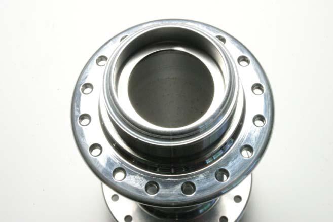 16), the washers should rest on the machined shoulder inside the hub shell (Fig.