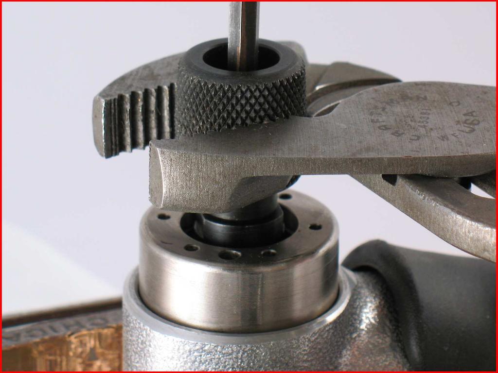 Use a 3/16" hex key, and pliers to tighten drive wheel. 10.
