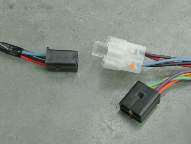 37. Once the module is secured, plug the black connector from the module into the clear connector with the corresponding orange, yellow, green and purple wires.
