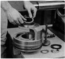 13. Remove the other shaft sleeve and nut as described in steps 11 and 12. NOTE: For impellers with replaceable rings remove the rings (4-004-9) by cutting the rings with a cold chisel. 14.