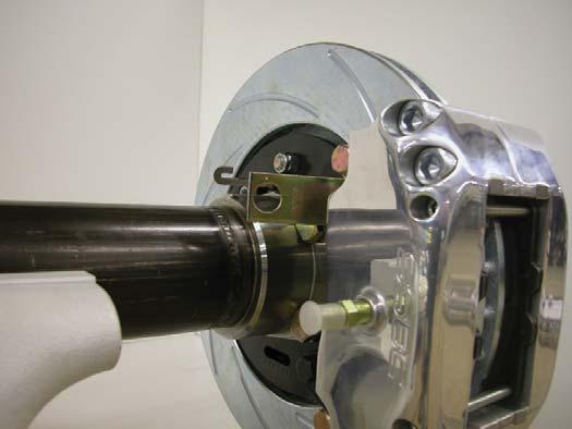 Photo 8: Slide the caliper into position over the rotor and secure with 3/8-24 bolts and lcok washers