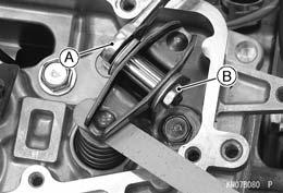 Periodic Maintenance Procedures Holding the adjusting bolt with a spanner [A], tighten the adjusting locknut [B] to the specified torque. Torque - Valve Clearance Adjusting Locknuts: 11 N m (1.