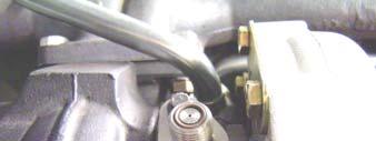 6. For trucks equipped with a boost control solenoid, remove the solenoid from the OE turbocharger (see